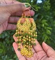 Gold and Green Crystal Beaded Chandelier Earrings with Sun Charm