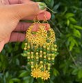 Gold and Green Crystal Beaded Chandelier Earrings with Sun Charm